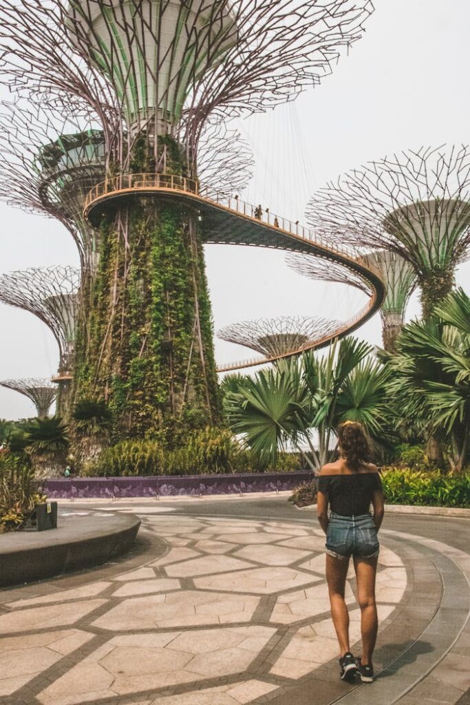 Mastering the First Impression: Your intriguing post title goes here Woman exploring the iconic Gardens by the Bay with Supertree Grove in Singapore.
