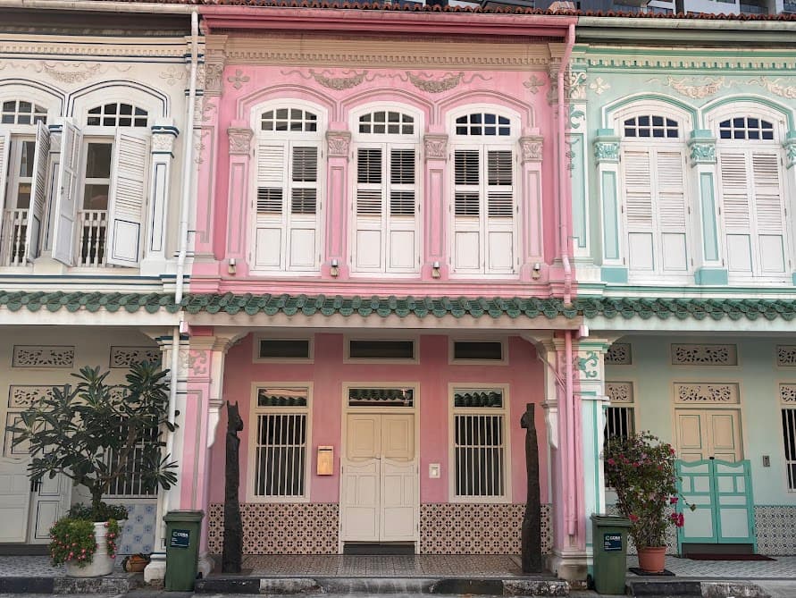 Row of pastel-colored traditional Peranakan shophouses in Tanjong Pagar, a popular photography stop on a Singapore walking trail.
