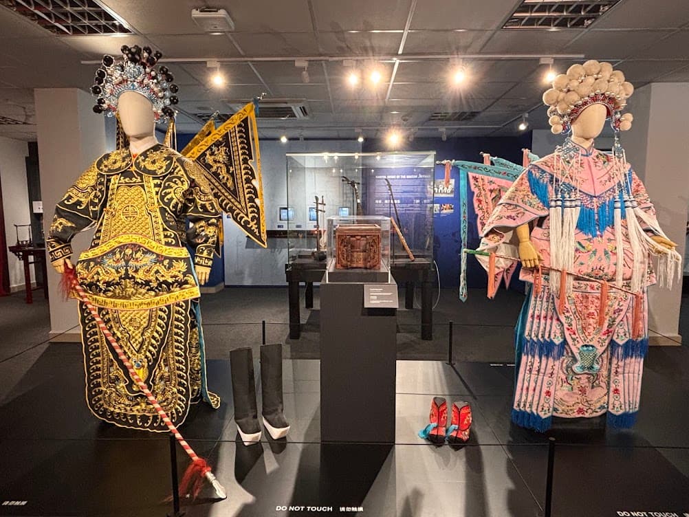 Male and female Cantonese opera armour costumes on display at a Singapore museum