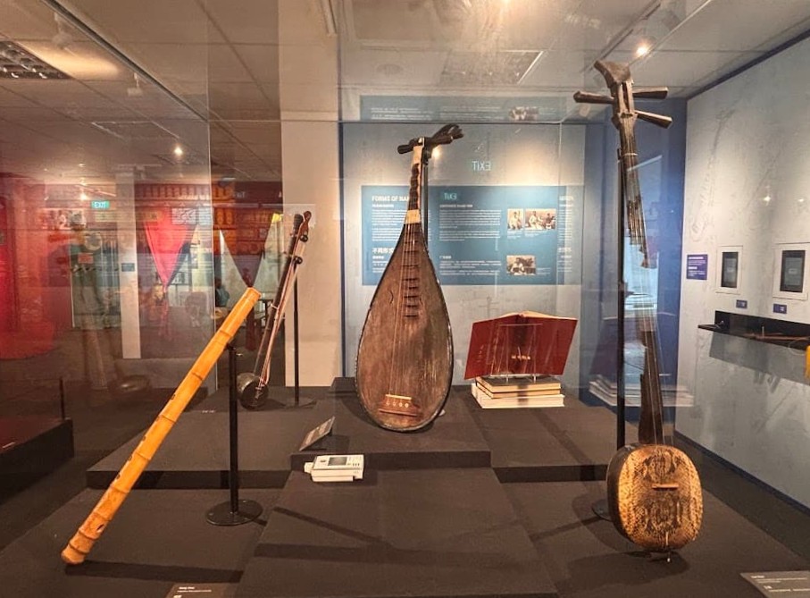 Chinese pipa lute on display in a museum gallery