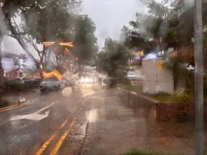 Rainy day in Singapore with heavy tropical rainfall on city streets